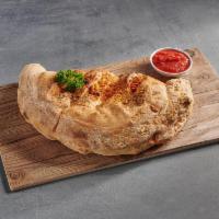 Build Your Own Calzone · Made with our fresh dough. Fresh mozzarella, red sauce and any 2 ingredients.