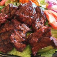 Steak Tip Salad · Our fresh garden salad topped with fresh savory marinated steak tips.