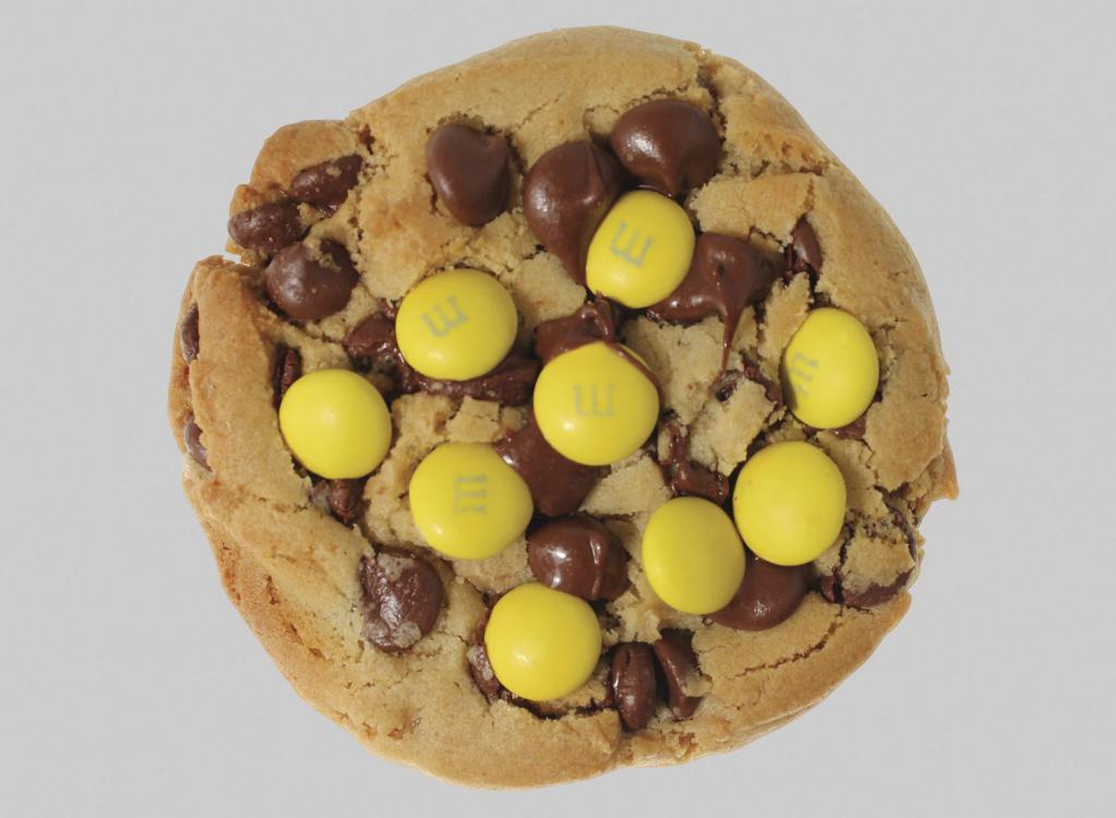 Courtney's Cookie · The perfect cookie recipe: toffee infused, loaded with yellow M&M's Chocolate Candies, and full of rich chocolate chips.