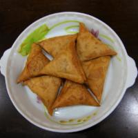 Vegetable Samosa · Crispy pastry filled with potatoes, peas and spices. Vegetarian