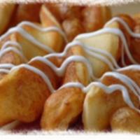 Cinnamon Twists · Our famous twists, rolled with a brown and white sugar cinnamon mixture and topped with a de...