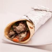 16. Steak Shawarma Wrap · Served with lettuce, tomatoes, onions, pickles tahini and garlic sauce. Served with choice o...