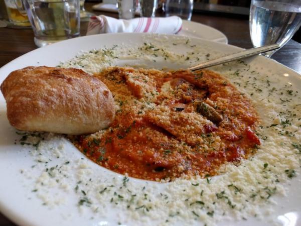 Pasta Sudtirol · Cheese truffle ravioli with onions, peppers, homemade tomato Parmesan sauce and a warm baguette.