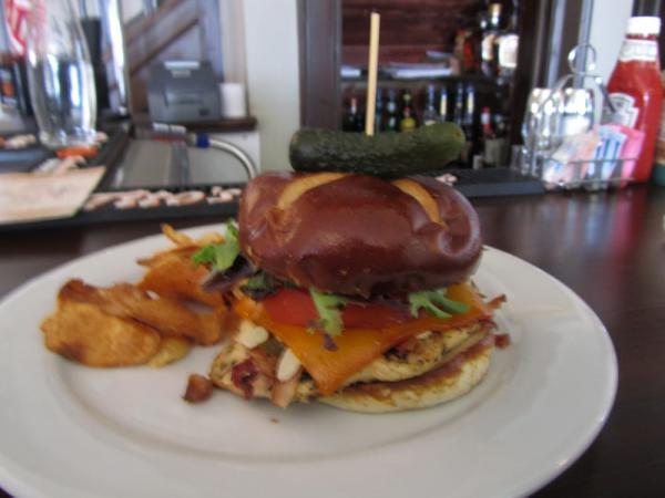 Valter's Chicken · Marinated chicken breast, bacon, roasted peppers, onions, almonds and smoked cheddar on a pretzel bun.
