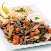 Beef Shawarma Plate · USDA Choice tri-tip marinated in our signature shawarma blend of spices served with choice o...