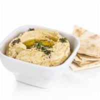 Hummus · Served with homemade blend of garbanzo beans and spices. Vegetarian.