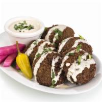 Falafel · Fresh ground chickpeas with a blend of spices served with tahini sauce. Vegetarian.