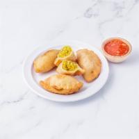 Thai Curry Puff · Pastry puff stuffed with minced chicken, onions, potatoes and curry powder. 