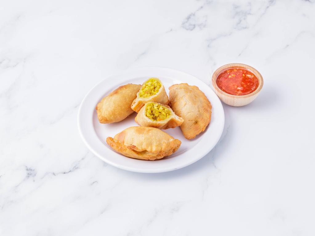 Thai Curry Puff · Pastry puff stuffed with minced chicken, onions, potatoes and curry powder. 