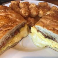 the breakfast sammie · 2 scrambled farm eggs | swiss | sweet + spicy bacon | house made tomato jam | freshly baked ...