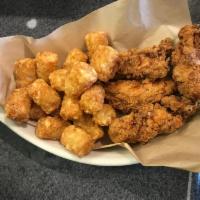 the chicken strips + tator tots · 4 crispy chicken strips | tater tots | served with house made bbq + ranch