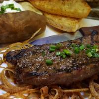 Dry aged Tavern Steak · 45 DAY DRY AGED 12oz. USDA choice New York Strip, grilled to temp, fried onion strings and a...