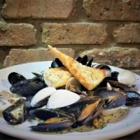 Drunken Mussels  · Fresh mussels sauteed with leeks, basil, lemon, garlic, beer served with garlic bread (over ...
