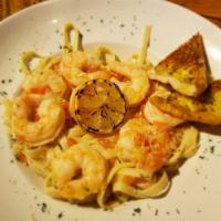 Shrimp Scampi · jumbo shrimp sautéed in garlic and butter, served over angel hair with garlic bread