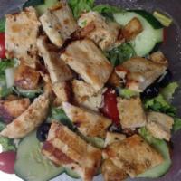 Grilled Salmon Salad · Garden salad topped with fresh Atlantic grilled salmon.