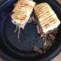 Steak and Avocado Panini · Hangar steak, avocado, caramelized onions, red pepper aioli and gruyere on a ciabatta roll. ...