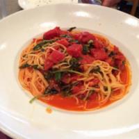 Tomato-Basil Spaghettine · Served with Roma tomatoes, basil, and garlic.