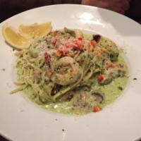 Shrimp and Scallop Linguini · Sauteed shrimp, scallops and mushrooms tossed in olive oil, herbs and a basil-pesto sauce. S...