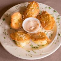 Nonna's Cauliflower Tosca · Egg and Romano cheese battered cauliflower, sauteed in olive oil and served with garlic sauce.
