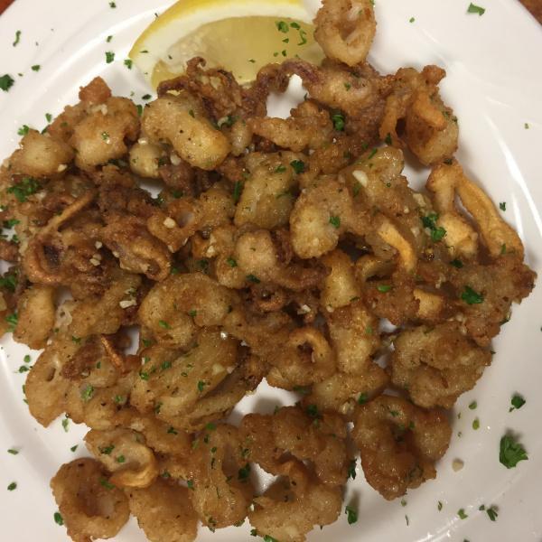 Sauteed Calamari · Lightly breaded and sauteed with garlic, olive oil and white wine. Tubes and tentacles.