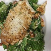 Caesar Salad · Comes with fresh romaine lettuce, Caesar dressing, homemade croutons and grated Parmesan che...