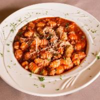 Gnocchi · Handmade with ricotta cheese and served with Bolognese Italian meat sauce and topped with sh...