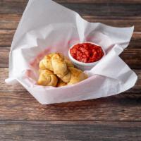 Garlic Knots · Approximately 10 with a side of homemade marinara sauce.
