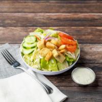 House Salad · Lettuce, tomatoes, red onions, carrots, cucumbers, mozzarella, and croutons.
