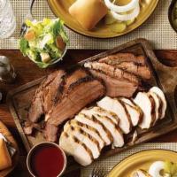 Family Pack · Includes a choice of 2 meats (1 lb. each), 3 medium sides, 6 rolls and barbecue sauce