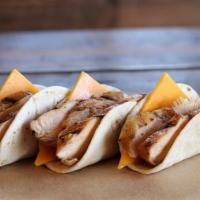 Chicken & Cheese Taco · Slow smoked marinated chicken, cheddar cheese on a flour tortilla