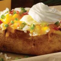 Giant Baker · A big ole spud filled with your favorite toppings of bacon, cheddar, onions and sour cream