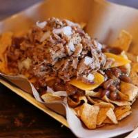 Fritos Pie Stack · Corn chips with your choice of barbecue beans or jalapeno beans and your choice of chopped b...