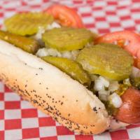 Chicago Style Dog · Mugsy dog, mustard, relish, tomato, onion, sport peppers, pickle chips and celery salt.