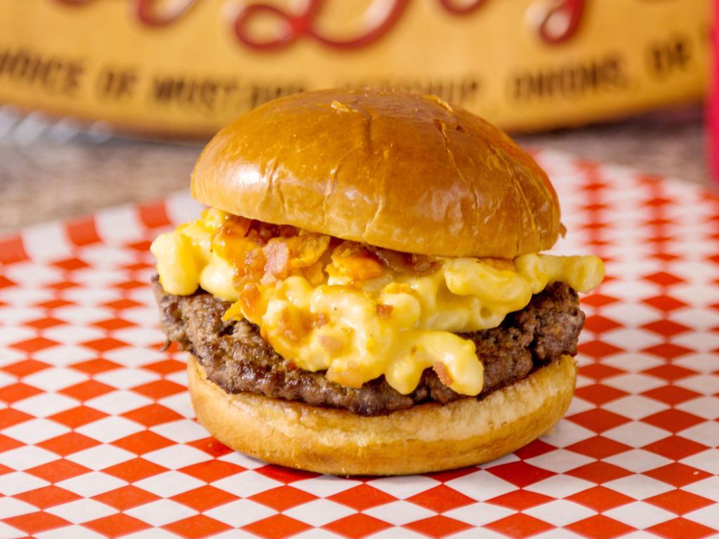 Mac N' Cheese Burger · All Angus Beef Patty, Mac N' Cheese, Cheese Crackers, Bacon Bits, and Mugsy Sauce