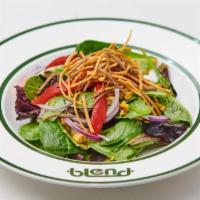 Latin Blend · Mixed greens, grilled corn, tomato, red onion, roasted peppers, crispy tortilla strips with ...