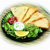 Quesadilla · Melted jack and cheddar cheeses in a large flour tortilla. For guacamole, sour cream and fre...
