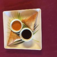 Chicken Samosa ( 2 Pcs) · Triangle pastries stuffed with mildly spiced chicken and peas and served with homemade chutn...