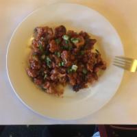 Gobhi Manchurian · Fresh cauliflower battered with corn flour, ginger & garlic paste and topped with spring oni...