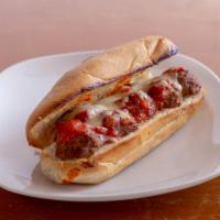 Meatball Parmigiana Sandwich ·  Sandwich with seasoned meat that has been rolled into a ball topped
with tomato sauce and c...