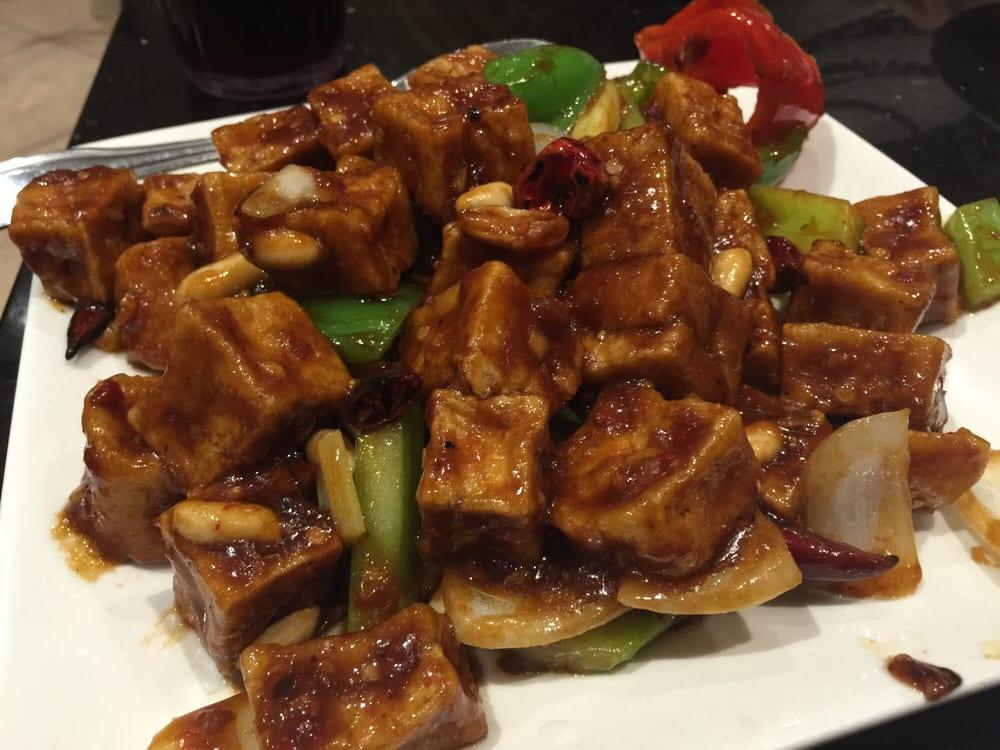 Kung Pao Chicken · Dark meat chicken sauteed with bell pepper and onion in a spicy brown sauce with peanuts. Spicy.
