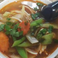 19. Tom Yum Goong · Lemon grass, mushroom, onion, bell pepper, carrot, galanga and lime juice served with Shrimp...