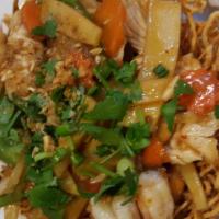 63. Leela Thai Basket · Crispy noodle basket topped with shrimp and chicken, bell pepper, cashew nut, bamboo shoot, ...