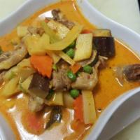 80. Roasted Duck Curry · Boneless chunks of roasted duck meat and sweet pineapple, simmered with coconut milk in red ...