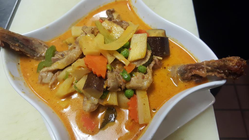 80. Roasted Duck Curry · Boneless chunks of roasted duck meat and sweet pineapple, simmered with coconut milk in red curry sauce. Served with steamed rice. Spicy.
