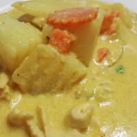 57. Yellow Curry · Coconut milk, potato, onion, peas and carrot. Served with steamed rice. Spicy.
