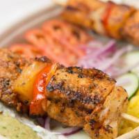 Kickin' K-Bob Bowl · Jalapeno cilantro hummus with tomato, cucumber, onion, topped with a chicken kebob skewer. G...