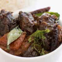Yennai Kathrikai Curry · Indian brinjal slit, deep fried and cooked in tamarind based gravy.