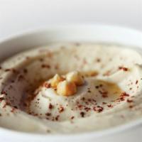 Original Hummus · Mashed garbanzo beans mixed with tahini sauce, garlic and lemon juice. Topped with olive oil.