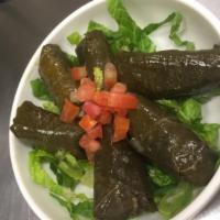 Grape Leaves · 6 grape leaves stuffed with rice, onion, tomato and parsley.