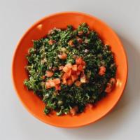 Tabbouleh Salad · Finely chopped parsley, tomato, onion and wheat bulgur. Mixed with lemon juice and extra vir...